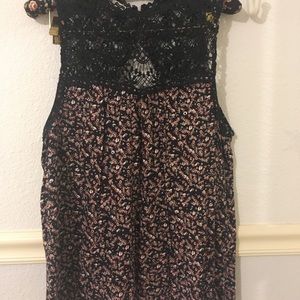 Sleeveless floral top with crocheted upper